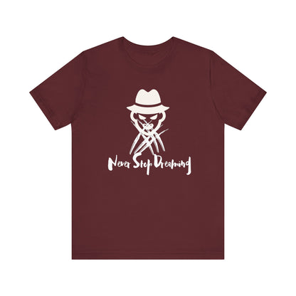 Comfortable Halloween unisex tee with Freddy Kruegar that states 'Never Stop Dreaming' in color maroon