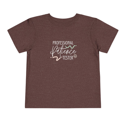 Comfortable funny graphic toddler tee stating 'Professional Patience Tester' in color  heather maroon