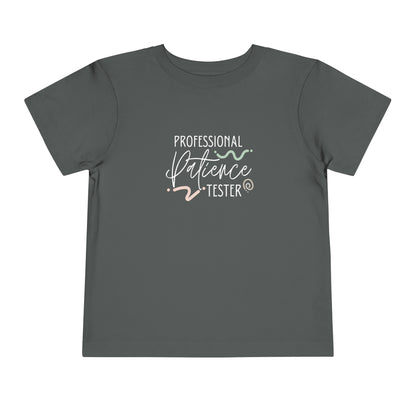 Comfortable funny graphic toddler tee stating 'Professional Patience Tester' in color  asphalt