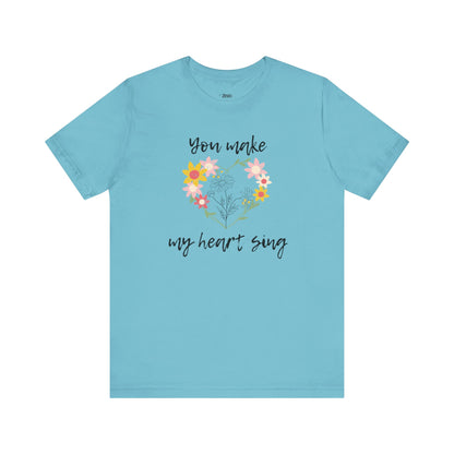 Adult graphic tee stating 'You Make My Heart Sing' in color aqua