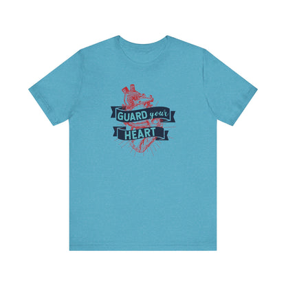 A cotton graphic tee stating 'Guard Your Heart' in color heather aqua