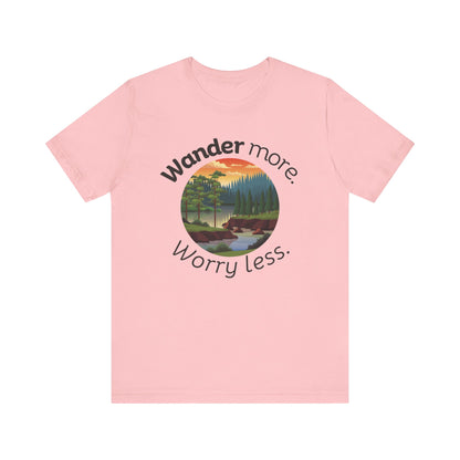 Cotton t-shirt stating 'Wander more. Worry less.' in color pink