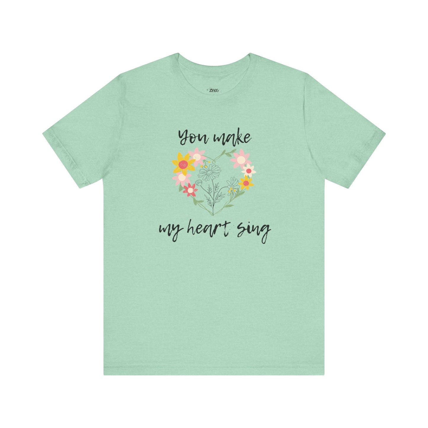 Adult graphic tee stating 'You Make My Heart Sing' in color mint heather