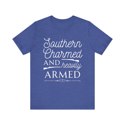 Adult unisex t-shirt stating 'Southern Charmed and Heavily Armed' in color true royal heather