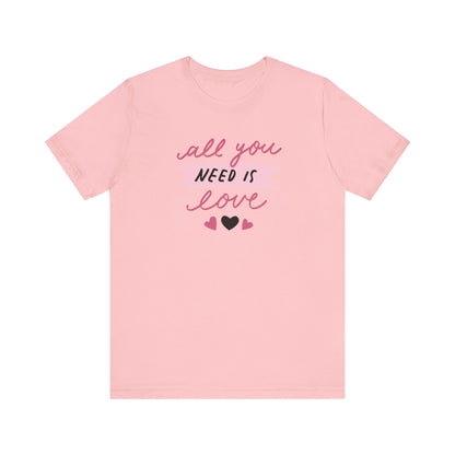 Comfortable Women's Graphic Tee Stating 'All You Need Is Love' in color pink