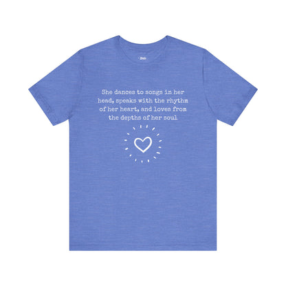 Comfortable good vibes graphic t-shirt stating 'She dances to songs in her head, speaks with the rhythm of her heart, and loves from the depths of her soul' in color columbia blue heather