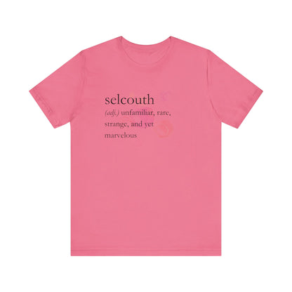 Comfortable women's good vibes tee that states 'selcouth (adj.) unfamiliar, rare, strange, and yet marvelous' in color charity pink