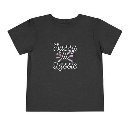 Comfortable funny graphic toddler tee stating 'Sassy Lil Lassie' in color  dark grey heather