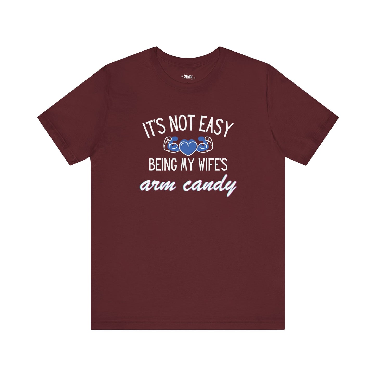 Graphic tee stating It's Not Easy Being My Wife's Arm Candy in color maroon
