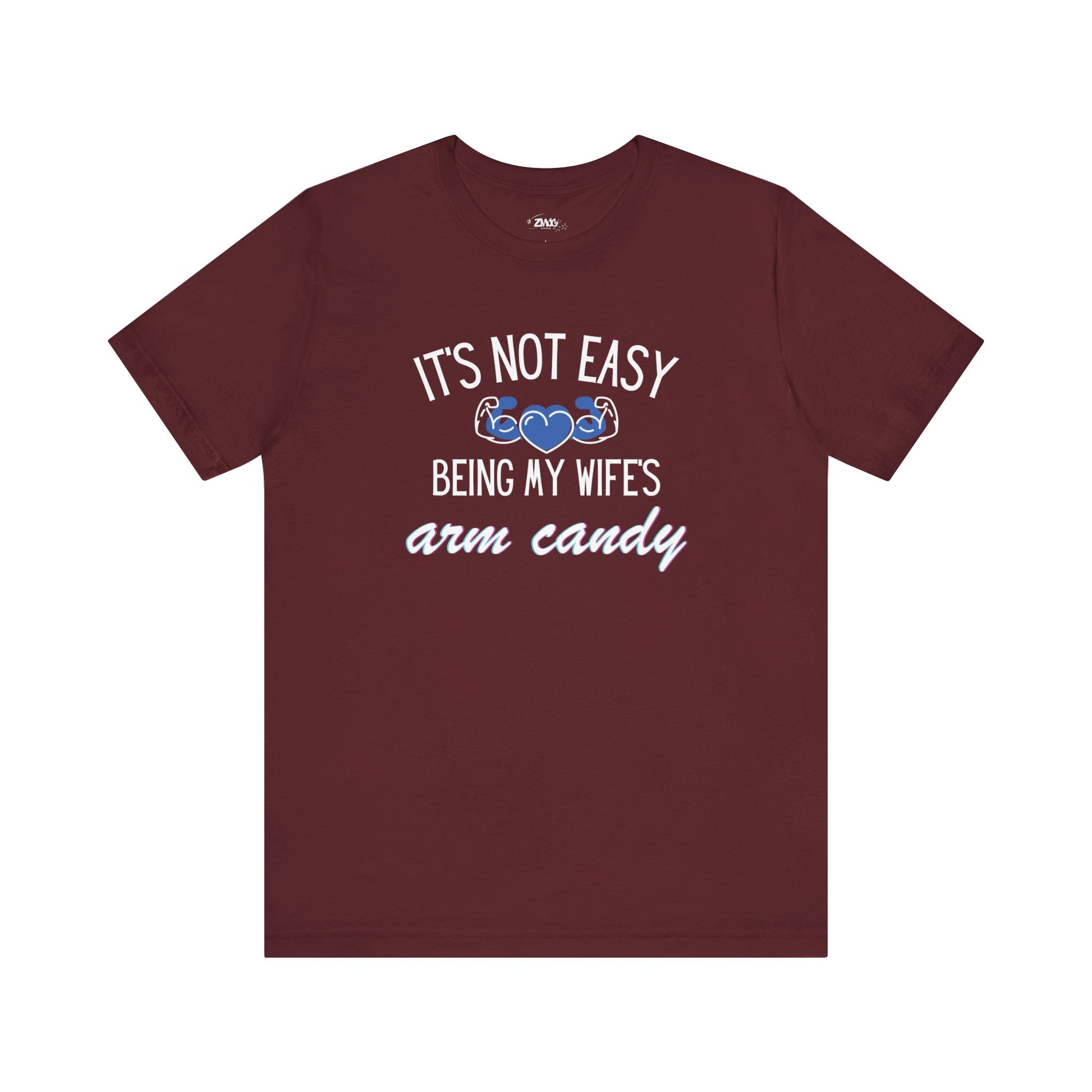 Graphic tee stating It's Not Easy Being My Wife's Arm Candy in color maroon