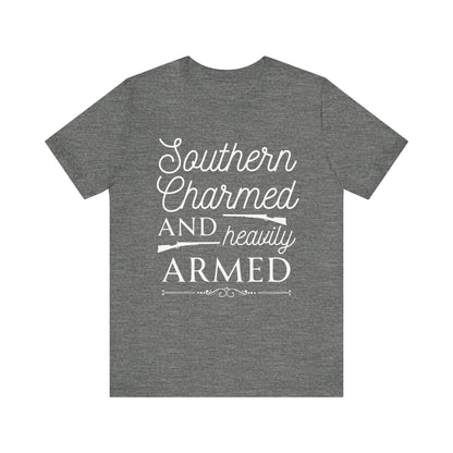 Adult unisex t-shirt stating 'Southern Charmed and Heavily Armed' in color deep heather