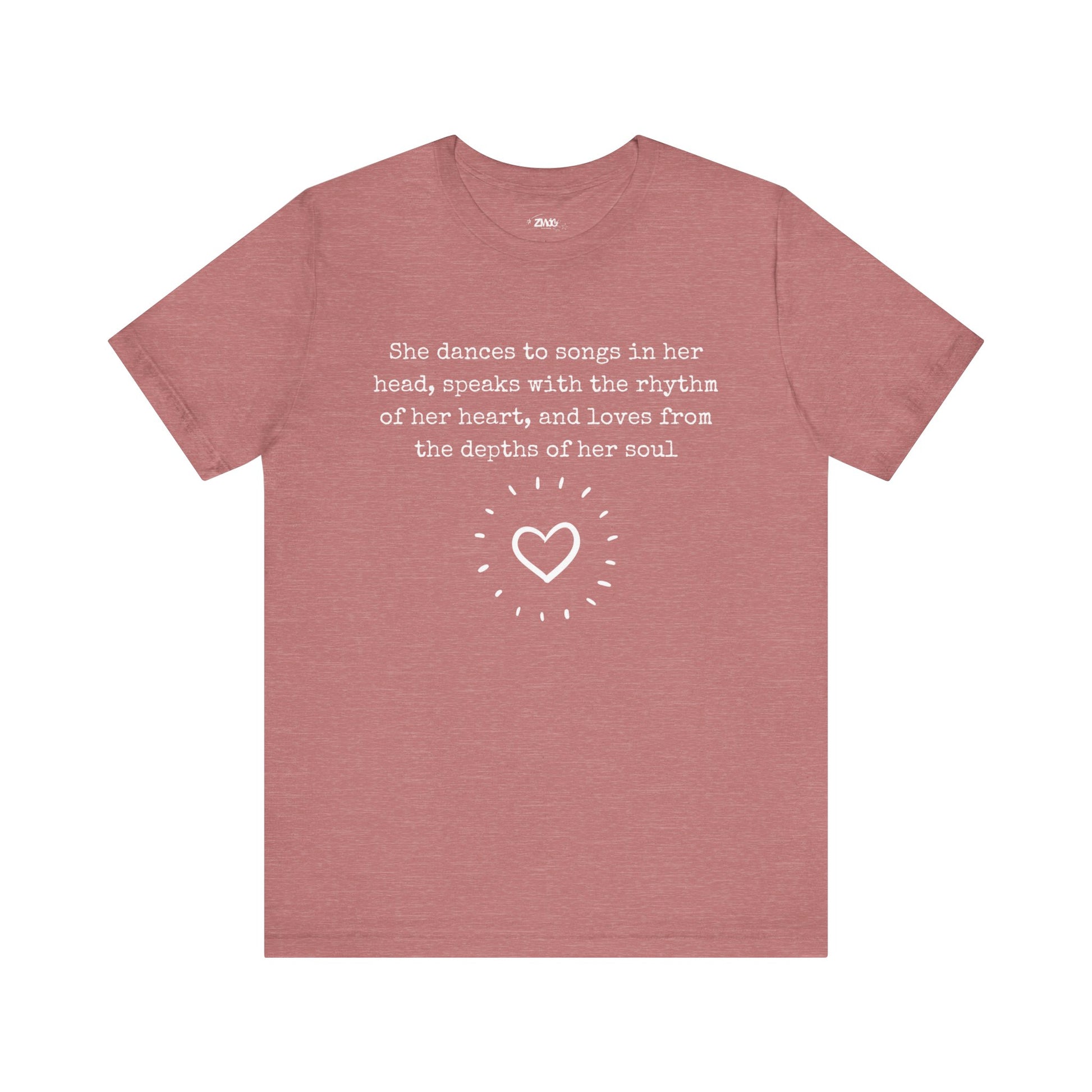 Comfortable good vibes graphic t-shirt stating 'She dances to songs in her head, speaks with the rhythm of her heart, and loves from the depths of her soul' in color heather mauve