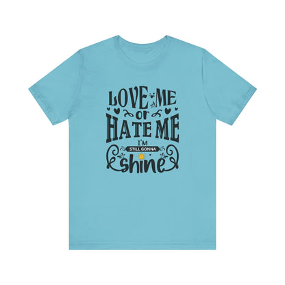 Women's good vibes graphic tee stating 'Love me or hate me, I'm still gonna shine' in color turquoise