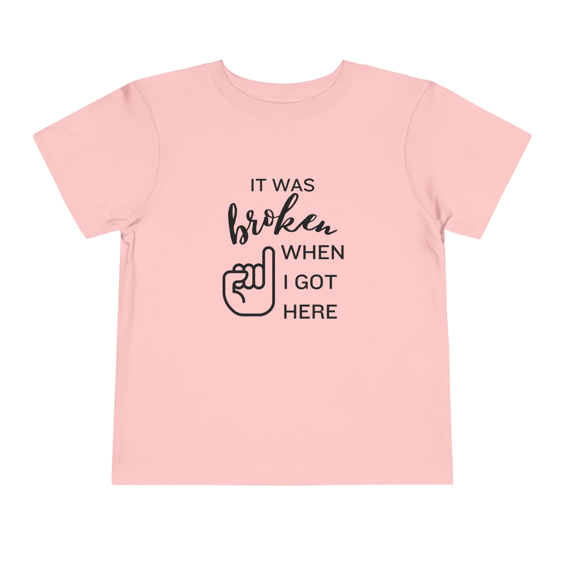 Comfortable funny graphic toddler tee stating 'It was broken when I got here' in color pink