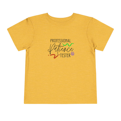 Comfortable funny graphic toddler tee stating 'Professional Patience Tester' in color  golden yellow heather