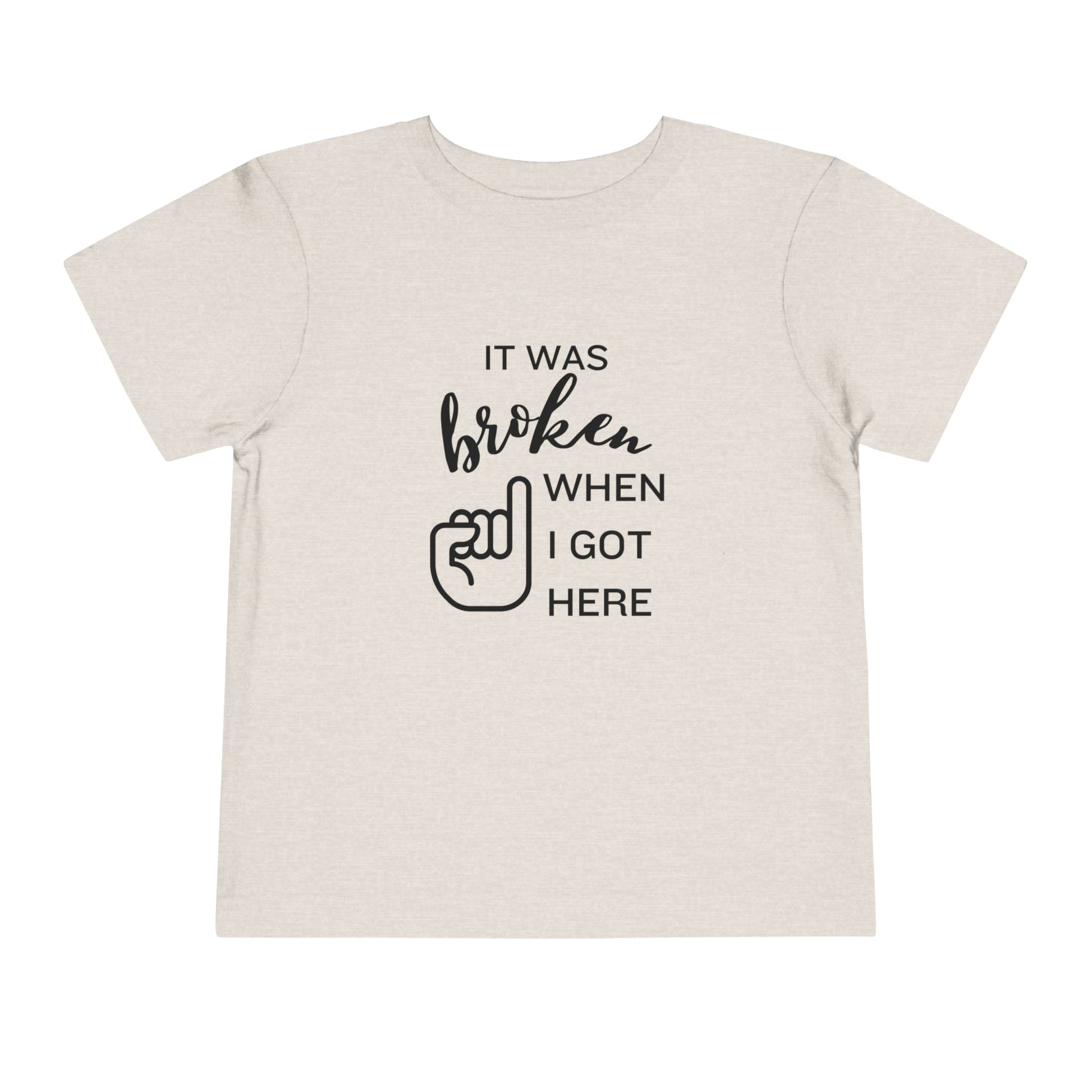 Comfortable funny graphic toddler tee stating 'It was broken when I got here' in color dust heather