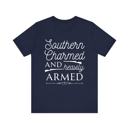 Adult unisex t-shirt stating 'Southern Charmed and Heavily Armed' in color navy