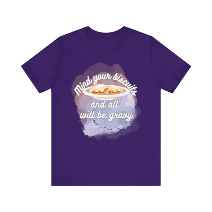 A comfortable funny southern graphic tee stating Mind You Biscuits and All will be Gravy in color purple
