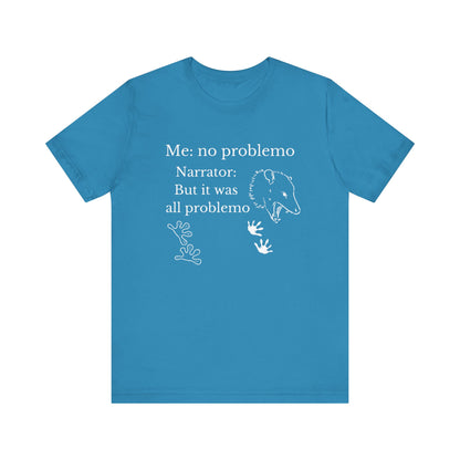 Funny graphic tee stating 'Me: no problemo - Narrator: but it was all problemo' in color aqua