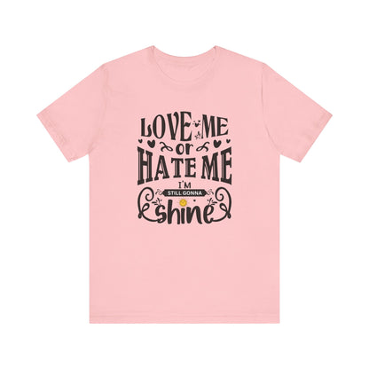 Women's good vibes graphic tee stating 'Love me or hate me, I'm still gonna shine' in color pink