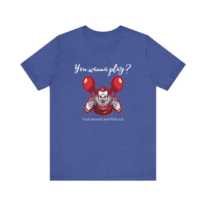 Unisex Halloween Tee stating 'You wanna play? Fuck around and find out.' with Pennywise in color true royal heather.