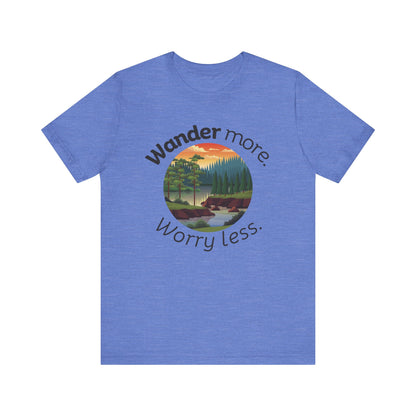 Cotton t-shirt stating 'Wander more. Worry less.' in color heather columbia blue