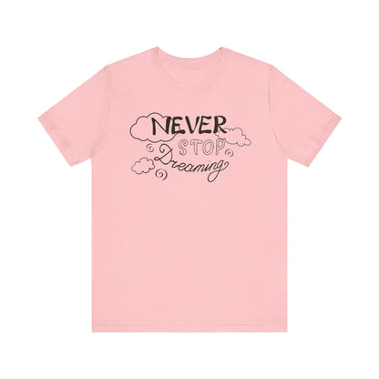 Good vibes women's tee stating 'Never Stop Dreaming' in color pink