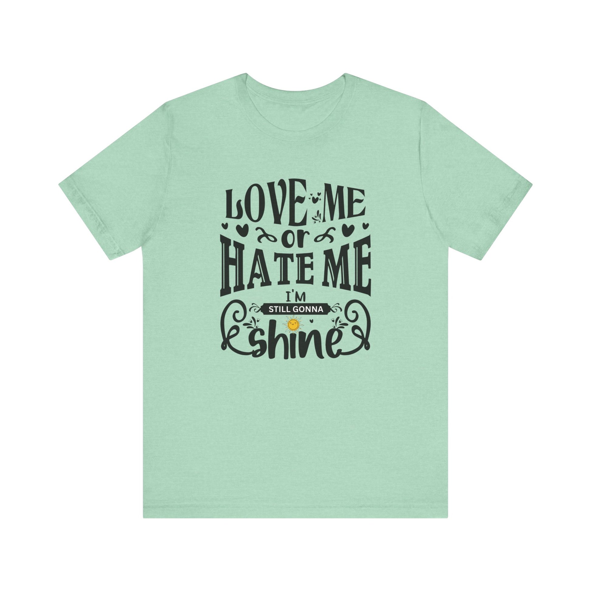 Women's good vibes graphic tee stating 'Love me or hate me, I'm still gonna shine' in color mint heather