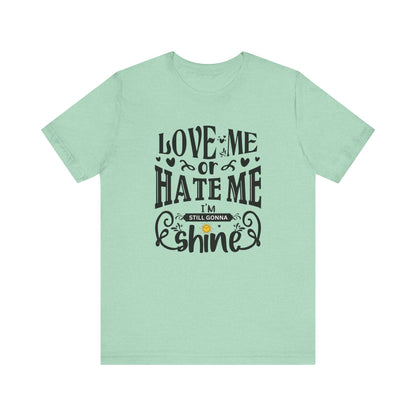Women's good vibes graphic tee stating 'Love me or hate me, I'm still gonna shine' in color mint heather