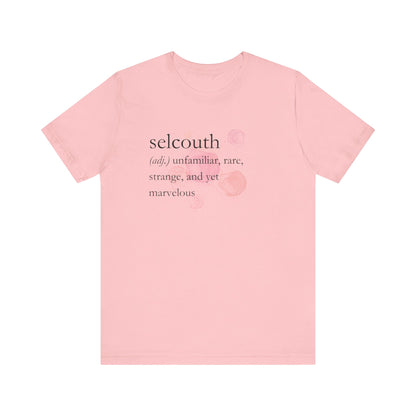 Comfortable women's good vibes tee that states 'selcouth (adj.) unfamiliar, rare, strange, and yet marvelous' in color pink