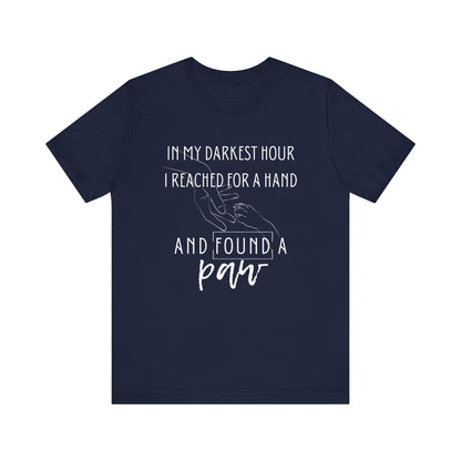 Comfortable graphic tee stating 'In my darkest hour I reached for a hand and found a paw' in color navy