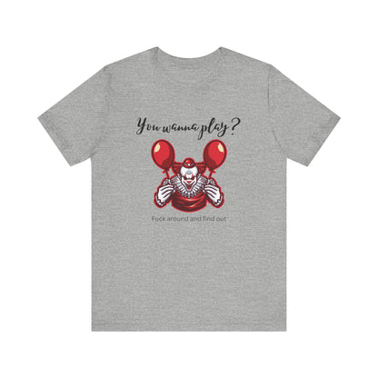 Unisex Halloween Tee stating 'You wanna play? Fuck around and find out.' with Pennywise in color athletic heather.
