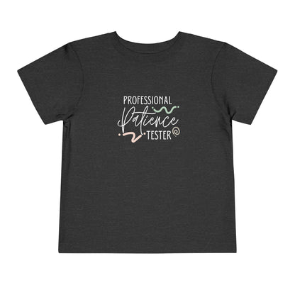 Comfortable funny graphic toddler tee stating 'Professional Patience Tester' in color  dark grey heather
