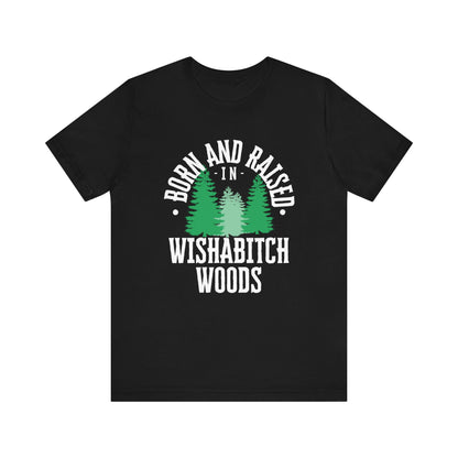 Comfortable adult humor tee stating Born and Raised in Wishab*tch Woods in color black