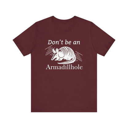 Unisex t-shirt stating 'Don't be an Armadillhole' in color maroon