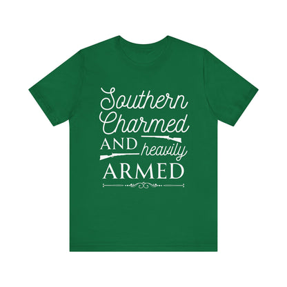 Adult unisex t-shirt stating 'Southern Charmed and Heavily Armed' in color kelly