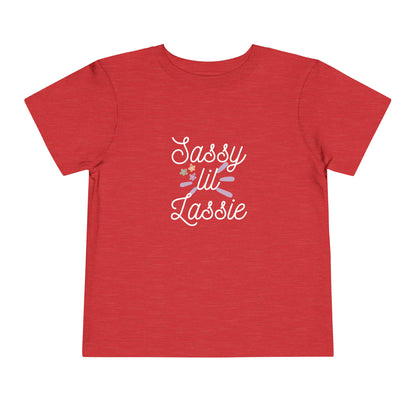 Comfortable funny graphic toddler tee stating 'Sassy Lil Lassie' in color  heather red