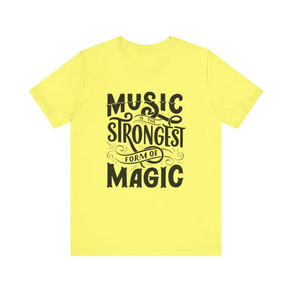 A comfortable good vibes tee stating 'Music is the strongest form of magic' in color yellow