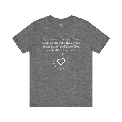 Comfortable good vibes graphic t-shirt stating 'She dances to songs in her head, speaks with the rhythm of her heart, and loves from the depths of her soul' in color deep heather