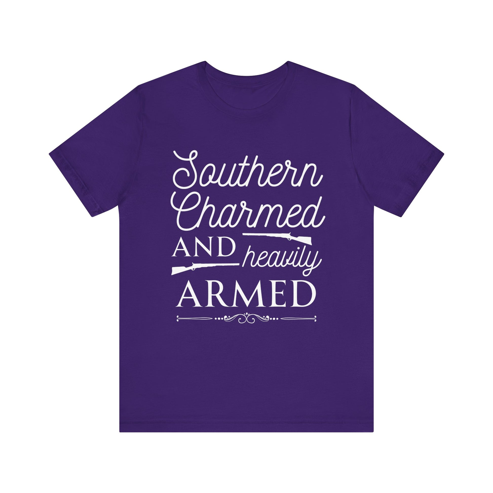 Adult unisex t-shirt stating 'Southern Charmed and Heavily Armed' in color team purple