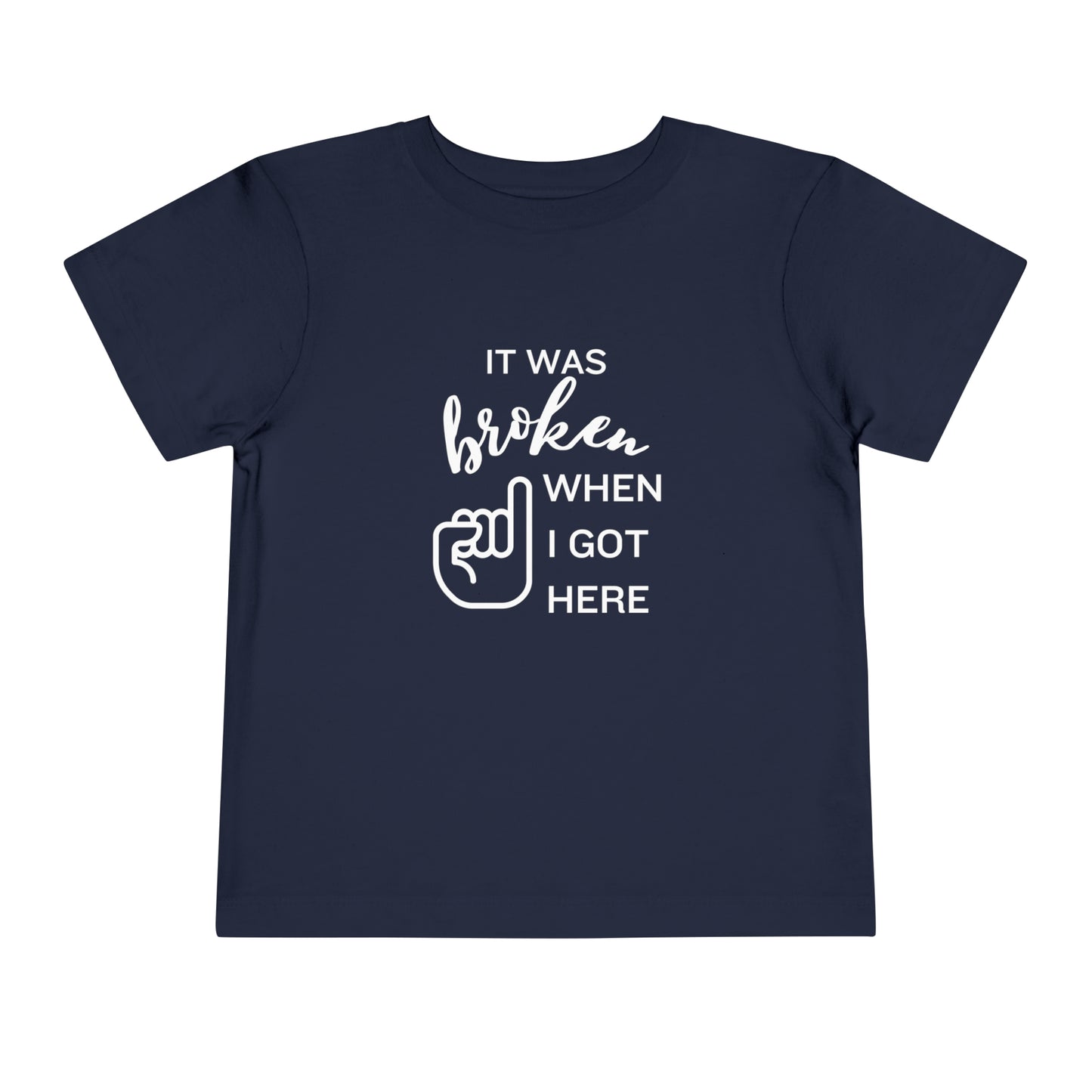 Comfortable funny graphic toddler tee stating 'It was broken when I got here' in color navy