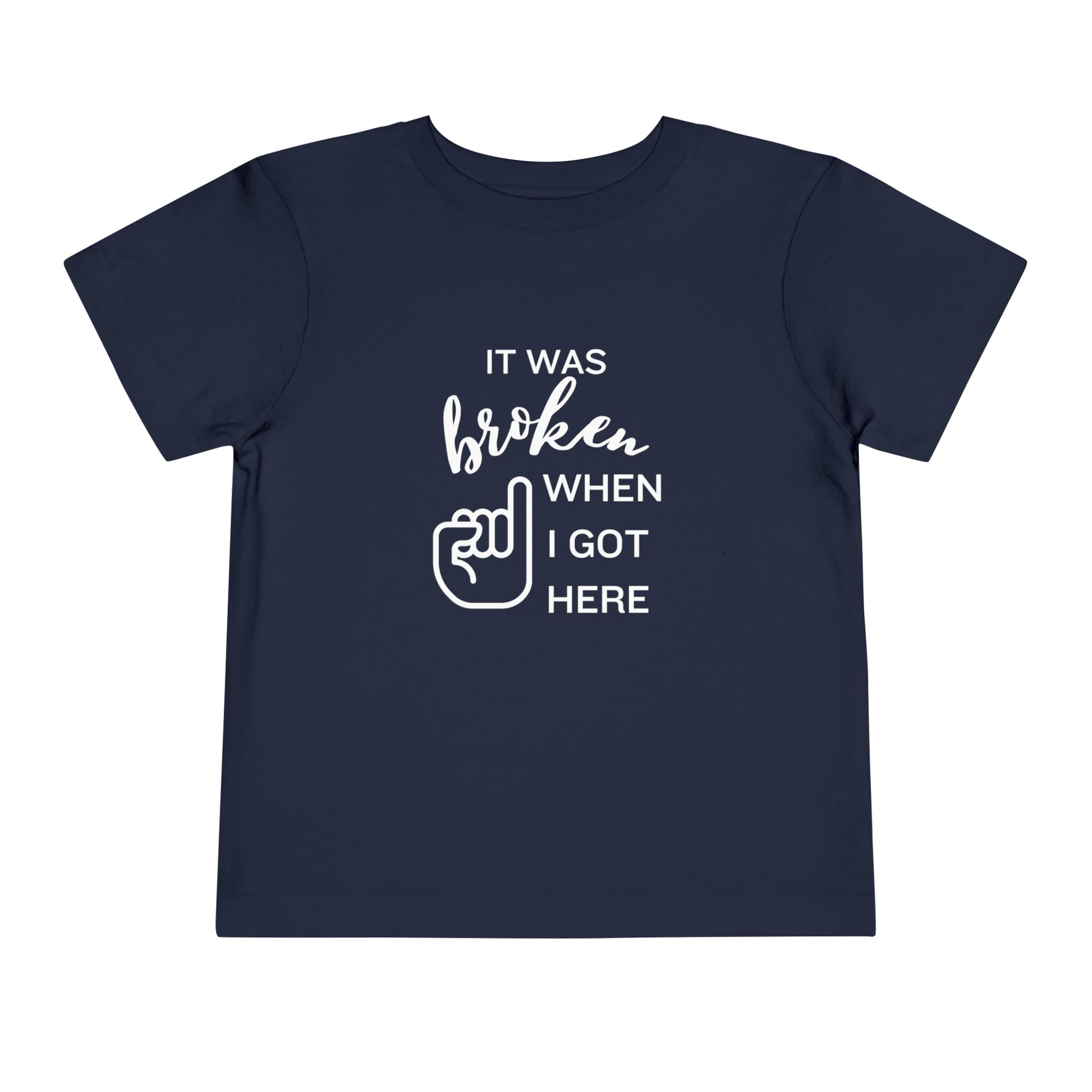 Comfortable funny graphic toddler tee stating 'It was broken when I got here' in color navy