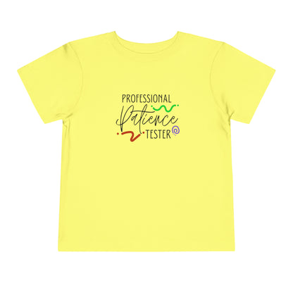 Comfortable funny graphic toddler tee stating 'Professional Patience Tester' in color  yellow