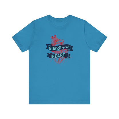 A cotton graphic tee stating 'Guard Your Heart' in color aqua