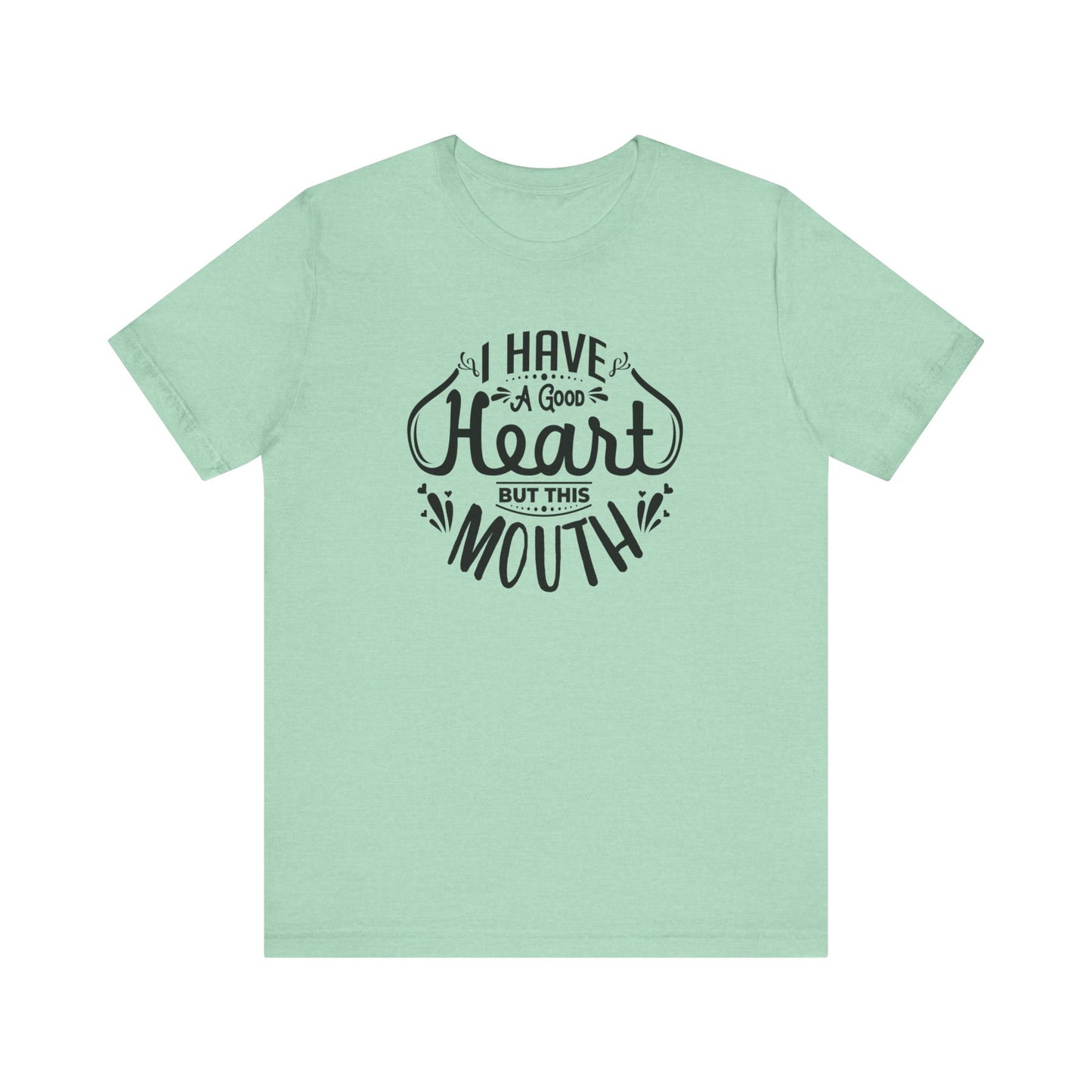Graphic tee stating 'I have a good heart, but this mouth' in color mint heather