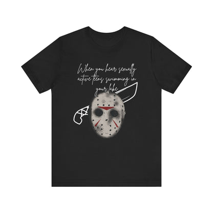 Unisex Comfortable Halloween tee with Jason mask that says 'When you hear sexually active teens swimming in your lake' in color black