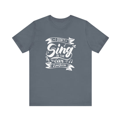 Graphic tee stating 'I Don't Sing in the Car, I perform' in color steel blue