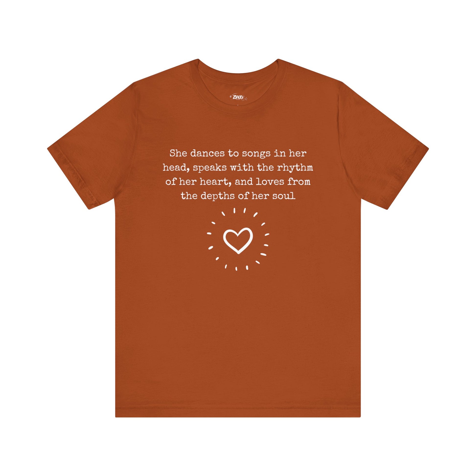 Comfortable good vibes graphic t-shirt stating 'She dances to songs in her head, speaks with the rhythm of her heart, and loves from the depths of her soul' in color autumn