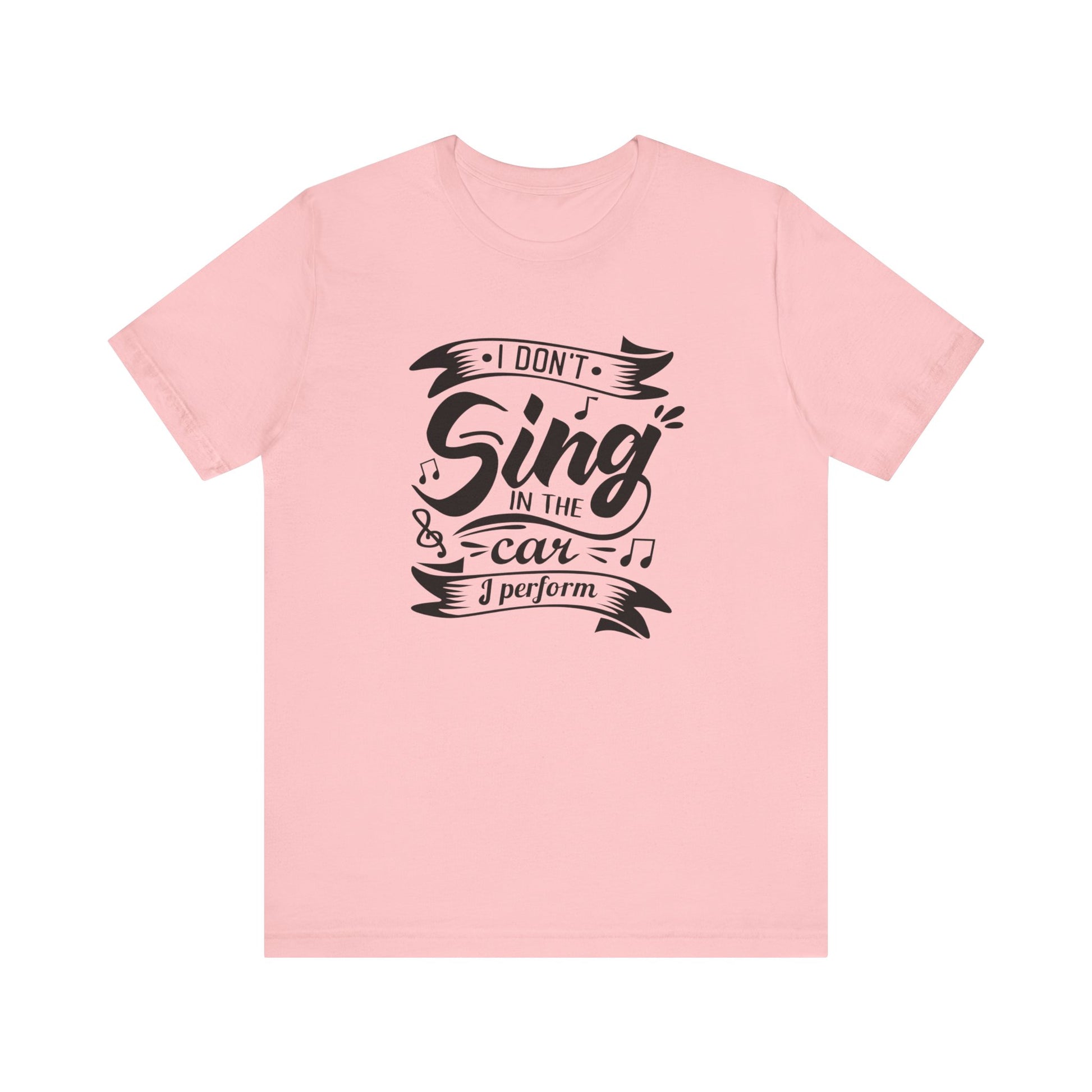 Graphic tee stating 'I Don't Sing in the Car, I perform' in color pink