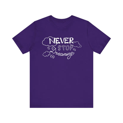 Good vibes women's tee stating 'Never Stop Dreaming' in color purple